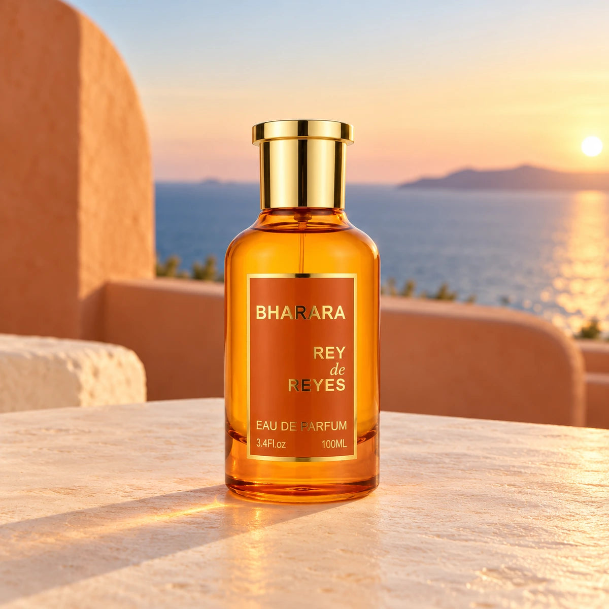 Bharara Rey de Reyes Orange Eau de Parfum de 100 ml sobre una mesa clara en una terraza mediterránea con el mar al atardecer