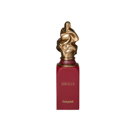 detalle del frasco de nayaat siralia, perfume frutal floral para mujer y hombre