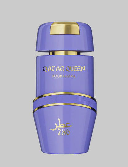 Detalle en primer plano del frasco de Qatar Queen Jo Milano mostrando reflejos dorados y etiqueta elegante