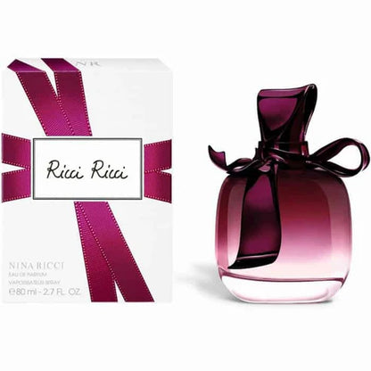 frasco del perfume ricci ricci de nina ricci 80 ml con lazo metálico púrpura y diseño elegante