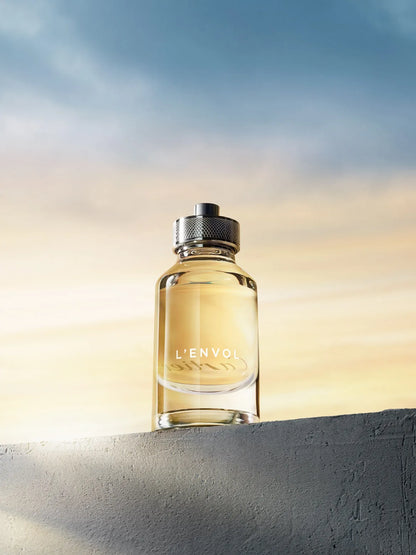 caja original del perfume cartier lenvol edt con logotipo de la marca y colores plateados y dorados