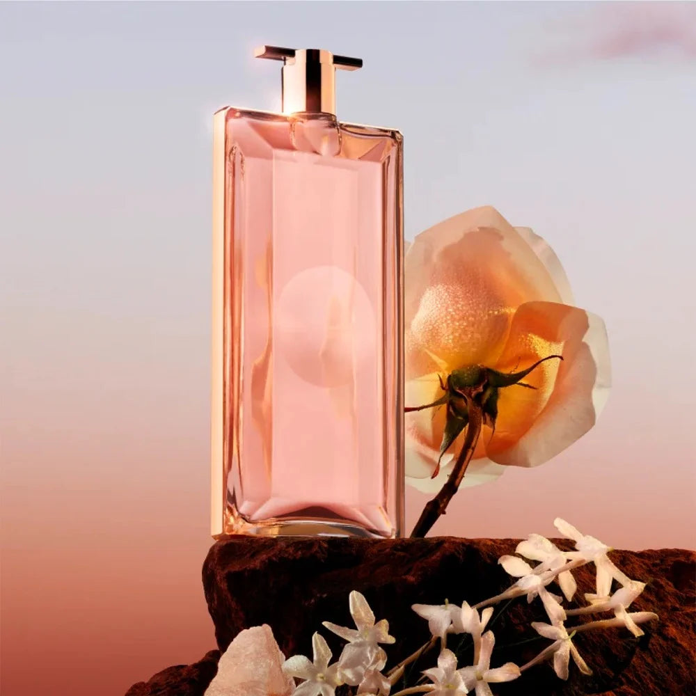 presentación completa del perfume idole le parfum lancome mujer 75 ml junto a su caja original en tonos rosados y dorados