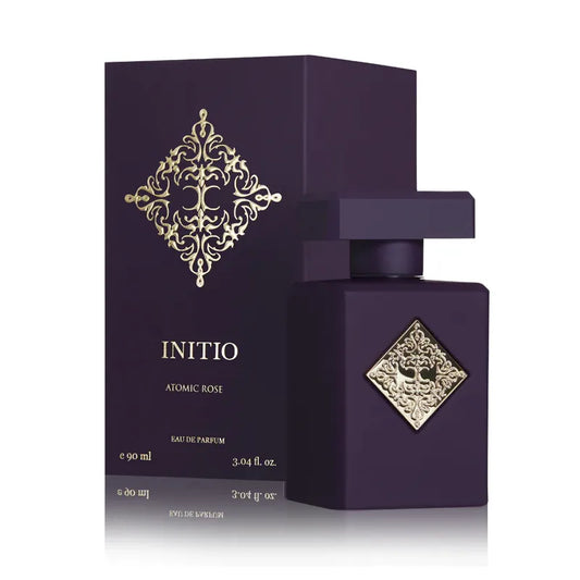 perfume initio atomic rose en frasco rojo intenso con detalles metálicos