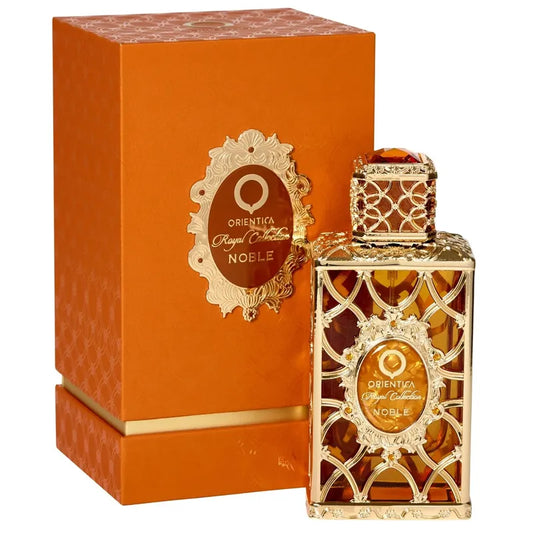 Botella dorada del perfume Orientica Noble Royal Collection 80ml EDP con diseño real y detalle de tapón corona