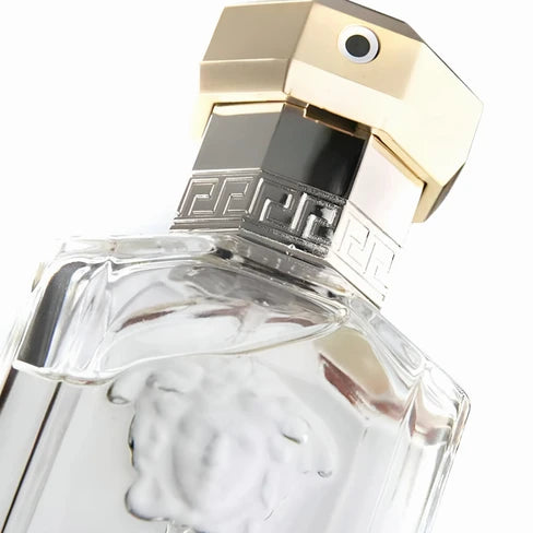 foto del perfume versace the dreamer 100 ml edt sobre fondo oscuro destacando su esencia clásica y sofisticada